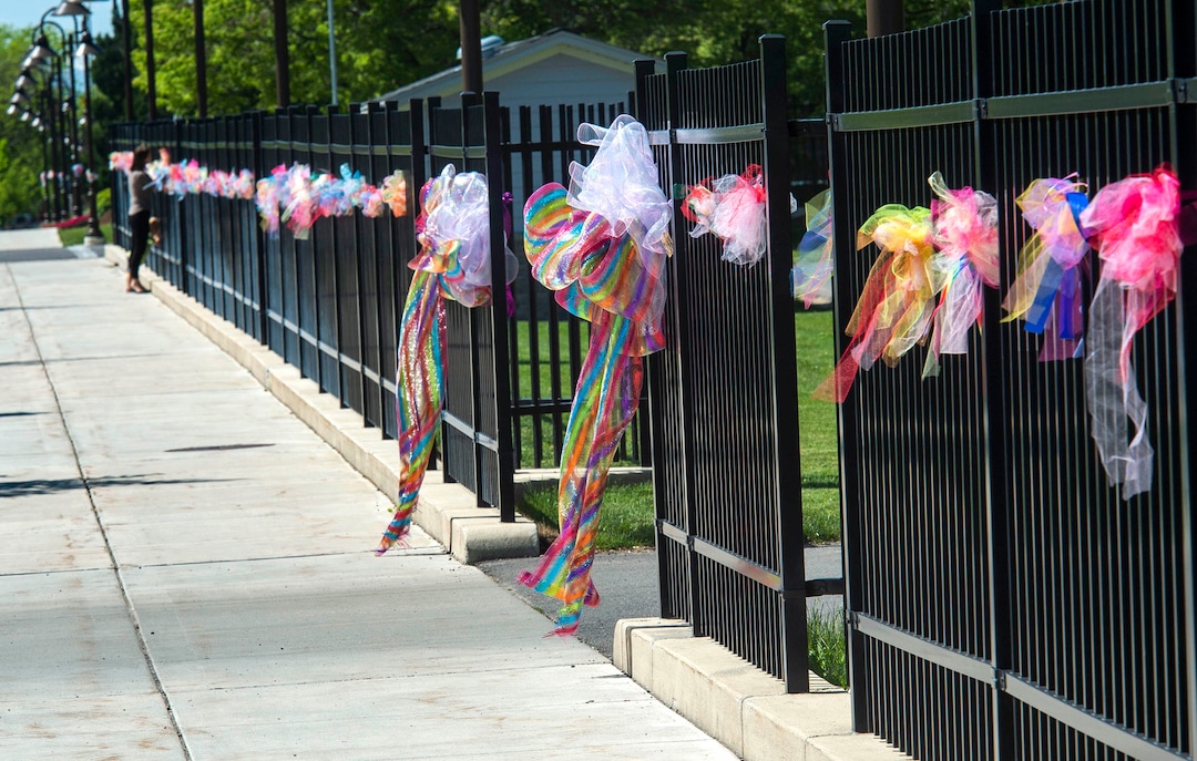 (Rick Egan  |  The Salt Lake Tribune)      Friend and loved ones the ribbons on the fence of the Logan City Cemetery before the funeral procession for five-year-old Elizabeth Shelley, who was allegedly killed by her uncle in Logan last week. Tuesday, June 4, 2019.