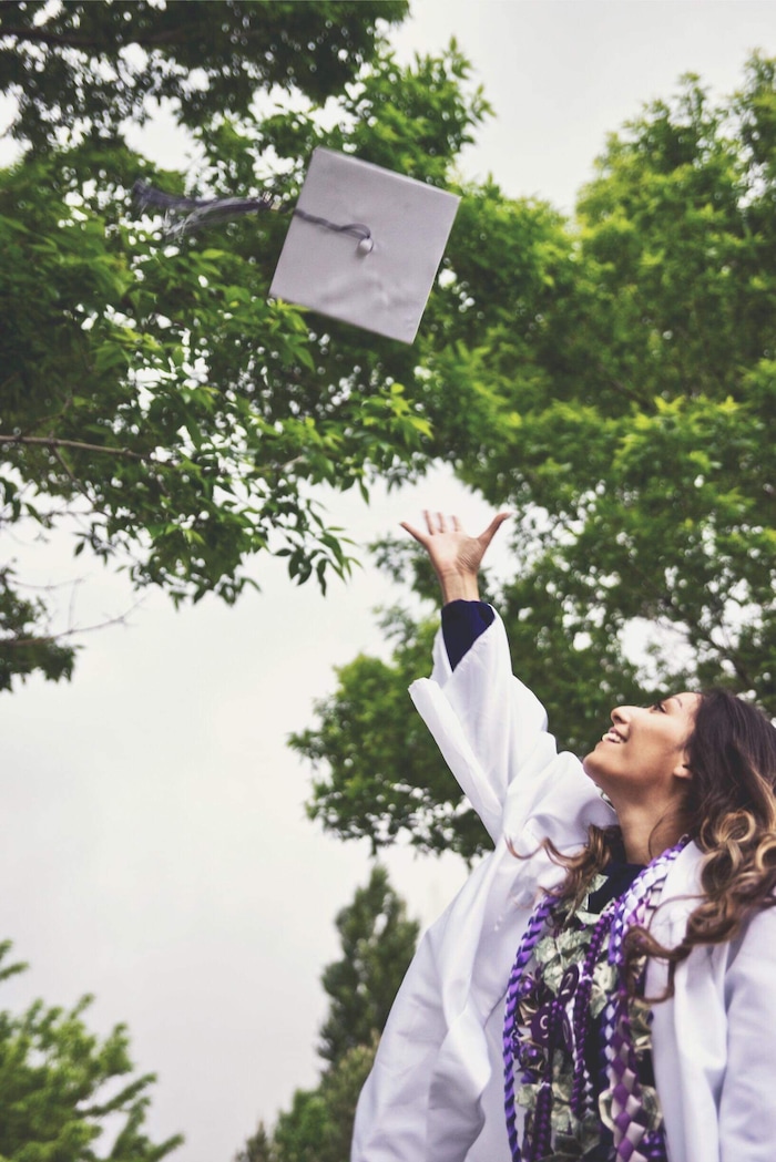 (Photo courtesy of Tasheena Savala) Pictured is Tasheena Savala with leis and decorations added after her graduation ceremony on May 29, 2019.