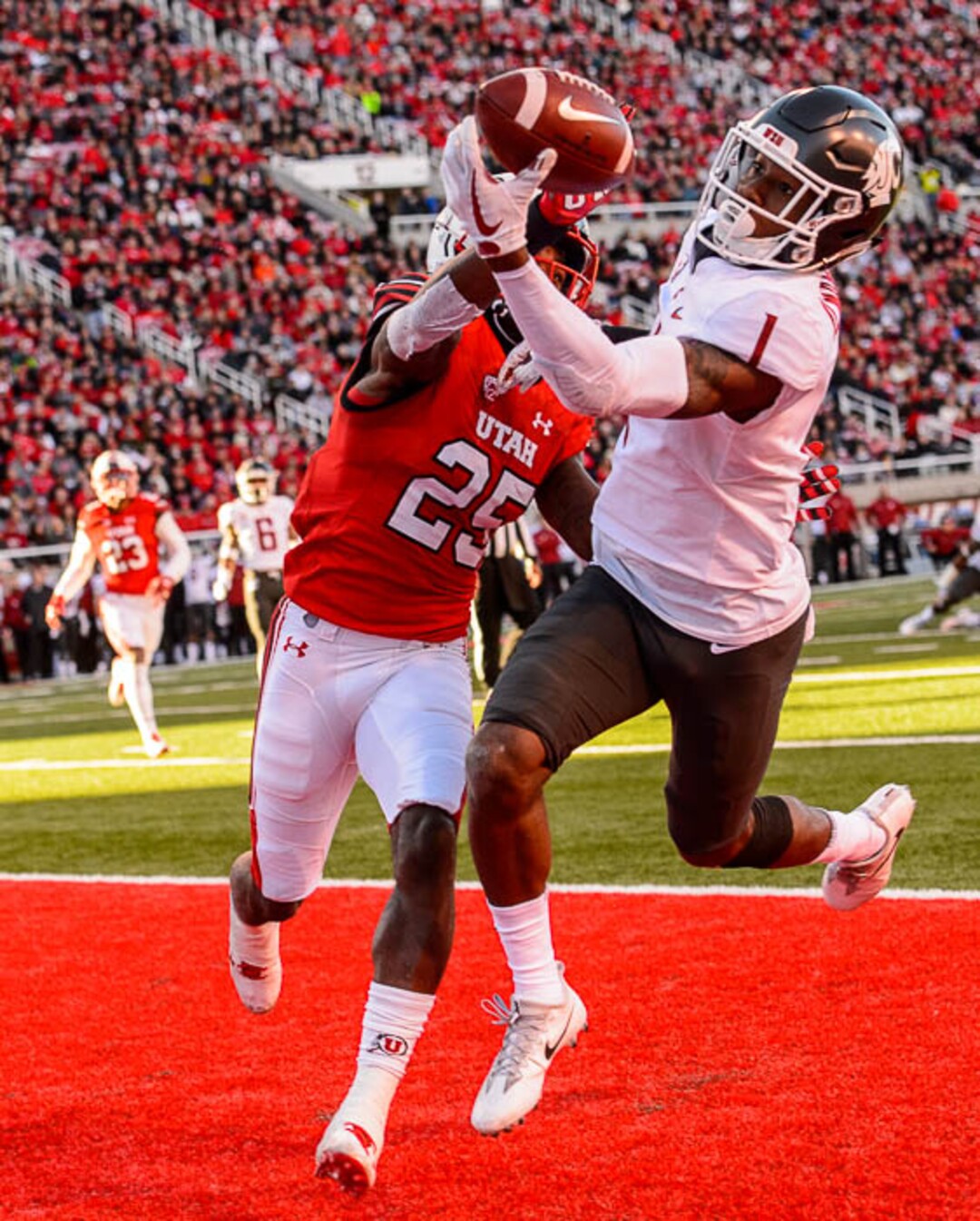 (Trent Nelson | The Salt Lake Tribune)  Utah Utes defensive back Casey Hughes (25) and Washington State Cougars wide receiver Davontavean Martin (1) reach for a pass that went incomplete as the University of Utah hosts Washington State, NCAA football in Salt Lake City, Saturday November 11, 2017.