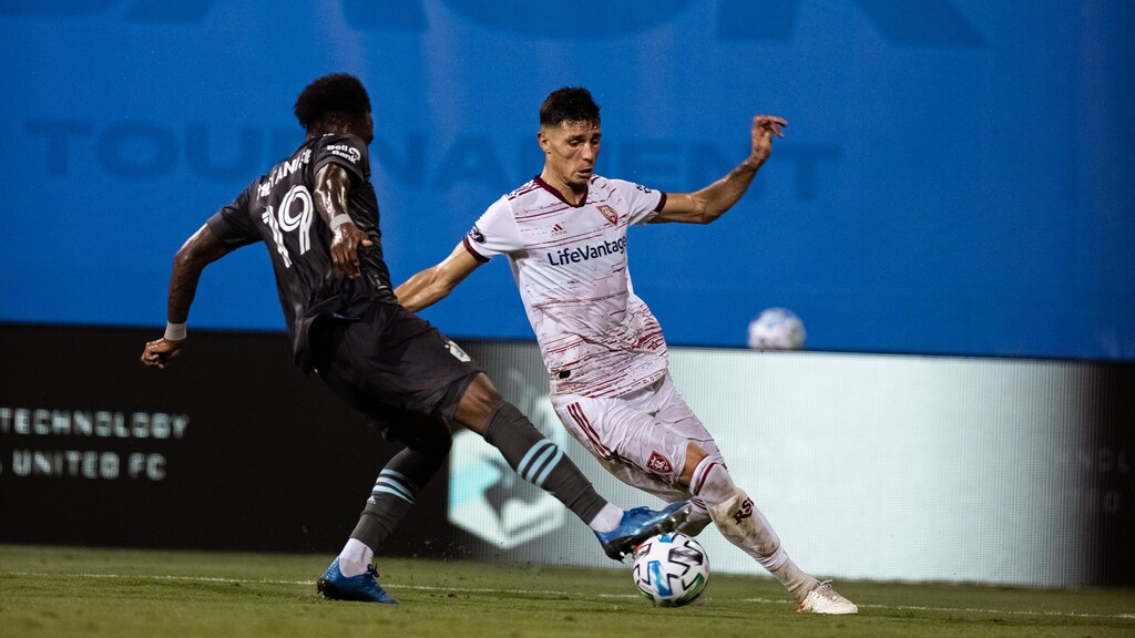 (Photo courtesy of Major League Soccer) Real Salt Lake midfielder Damir Kreilach dribbles against a Minnesota United defender during the scoreless draw on Friday, July 17, 2020.