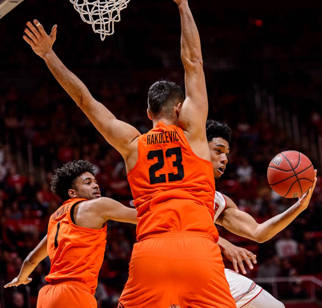 (Trent Nelson | The Salt Lake Tribune)  Utah Utes guard Sedrick Barefield (2) drives around Oregon State Beavers center Gligorije Rakocevic (23) as Utah hosts Oregon State, NCAA basketball in Salt Lake City on Saturday Feb. 2, 2019. At left is Oregon State Beavers guard Stephen Thompson Jr. (1).
