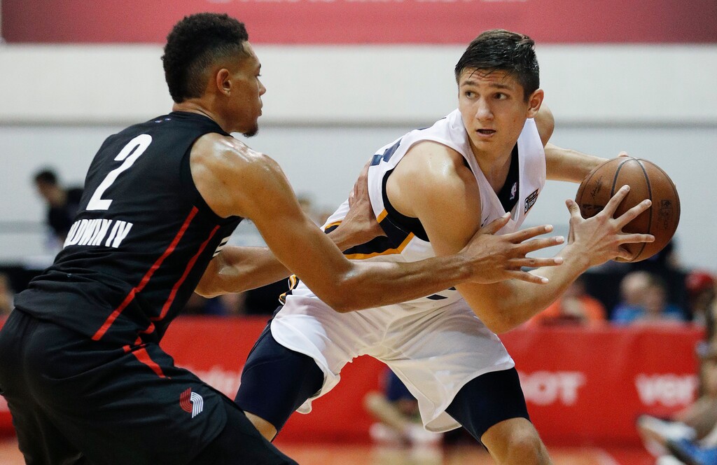Portland Trail Blazers' Wade Baldwin IV, left, guards Utah Jazz's Grayson Allen during the second half of an NBA summer league basketball game Saturday, July 7, 2018, in Las Vegas. (AP Photo/John Locher)
