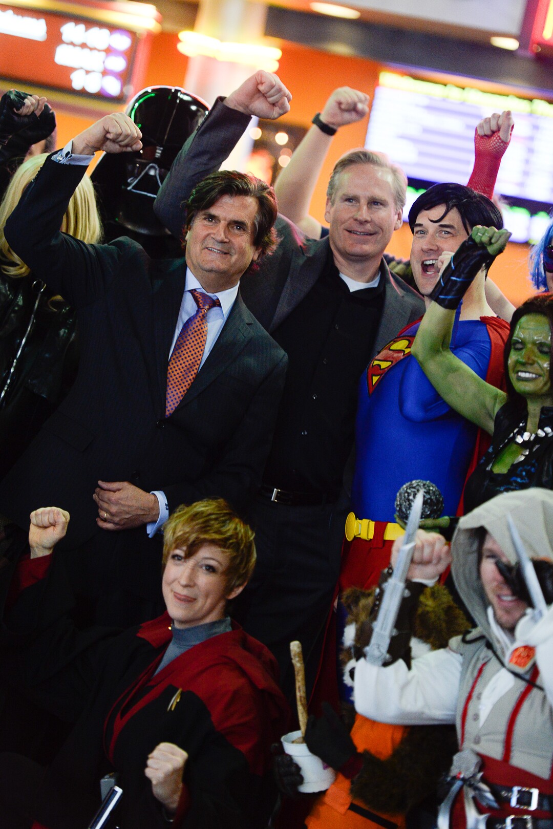 (Francisco Kjolseth  |  The Salt Lake Tribune) Bryan Brandenburg, center left, and Dan Farr, co-founders of the Salt Lake Comic Con join cosplay fans for a picture following their announcement of FanX, Jan. 29-31, 2015 during a press announcement at the Megaplex 17 at Jordan Common in Sandy on Wednesday, Nov. 19, 2014.