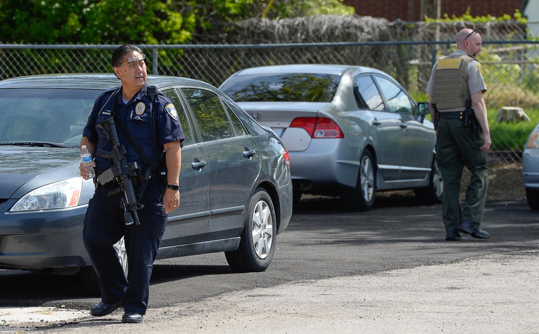 (Francisco Kjolseth  |  The Salt Lake Tribune)  Police work near the scene of a shooting at Pawn and Sales, 135 S. and 500 West, in Bountiful on Friday, May 4, 2018, where two men attempted to rob the store. One suspect was killed in a "scuffle" with a staff member while the other one fled the scene.