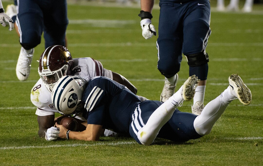 (Francisco Kjolseth  |  The Salt Lake Tribune) Brigham Young Cougars quarterback Zach Wilson (1) fumbles a snap recovered by Texas State near the end zone before the defensive lineup was able to stop any attempts at a touchdown by Texas State during an NCAA college football game at LavVell Edwards Stadium, Saturday, oct. 24, 2020, in Provo, Utah.
