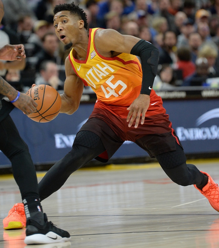 (Francisco Kjolseth  |  The Salt Lake Tribune)  Utah Jazz guard Donovan Mitchell (45) maneuvers around the Pistons defense in the first half of their NBA game at Vivint Smart Home Arena Monday, Jan. 14, 2019, in Salt Lake City.