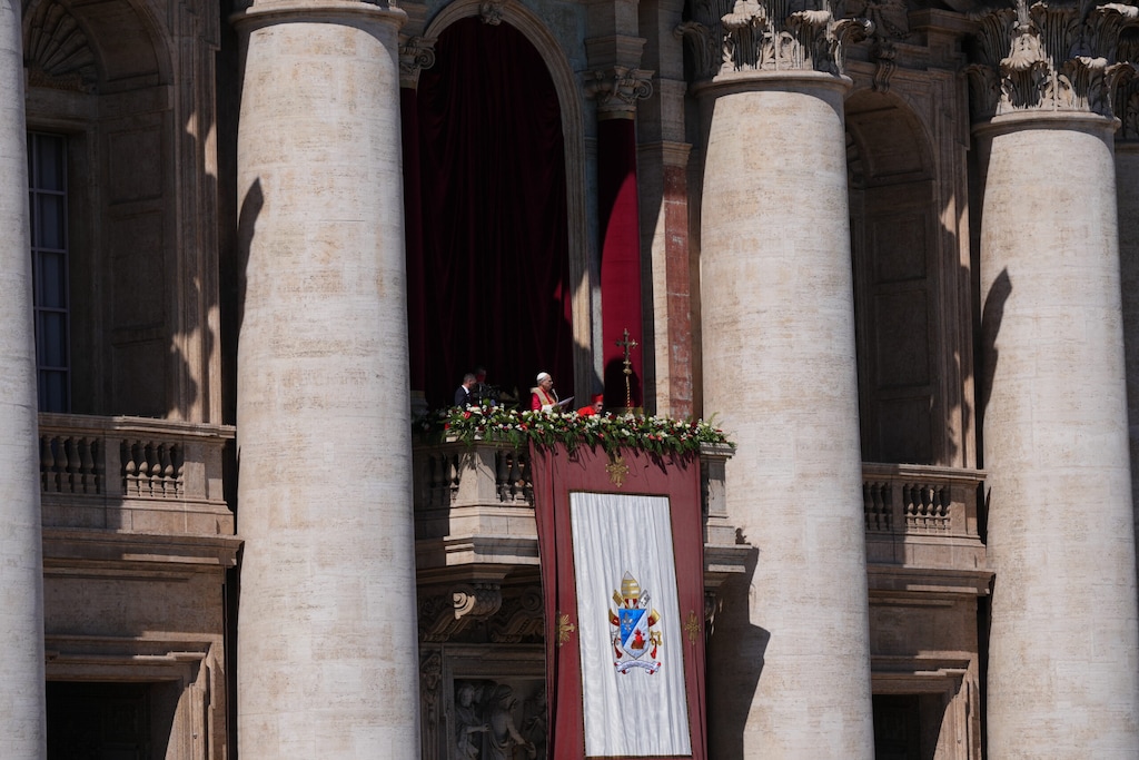 (Alessandra Tarantino | AP via RNS) Pope Leo XIV addresses the faithful from St. Peter's Basilica at the end of Easter Mass at the Vatican on Sunday, April 5, 2026.