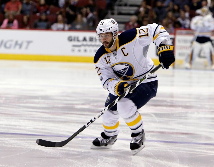 FILE - In this Feb. 26, 2017, file photo, then-Buffalo Sabres right wing Brian Gionta (12) skates in the first period during an NHL hockey game against the Arizona Coyotes, in Glendale, Ariz. USA Hockey revealed its roster for the upcoming Deutschland Cup, the best indication so far of what the Olympic team will look like without NHL players.The 29-player roster includes Gionta. (AP Photo/Rick Scuteri, File)