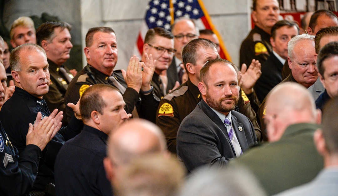 Leah Hogsten  |  The Salt Lake Tribune   Utah law enforcement agencies recognize Millard County Sheriff's department and Doug Fox, the husband of Millard County sheriff's Deputy Josie Greathouse Fox who was killed on duty in 2010 during a ceremony celebrating the one year success of Project Safe Neighborhoods, October 3, 2018, at theCapitol. Wednesday marked the one year anniversary since the Trump administration returned to the policy pushed by the George W. Bush administration. Under Project Safe Neighborhoods, federal prosecutors focus on security stiff sentences for those convicted of gun crimes and reducing violent crimes.