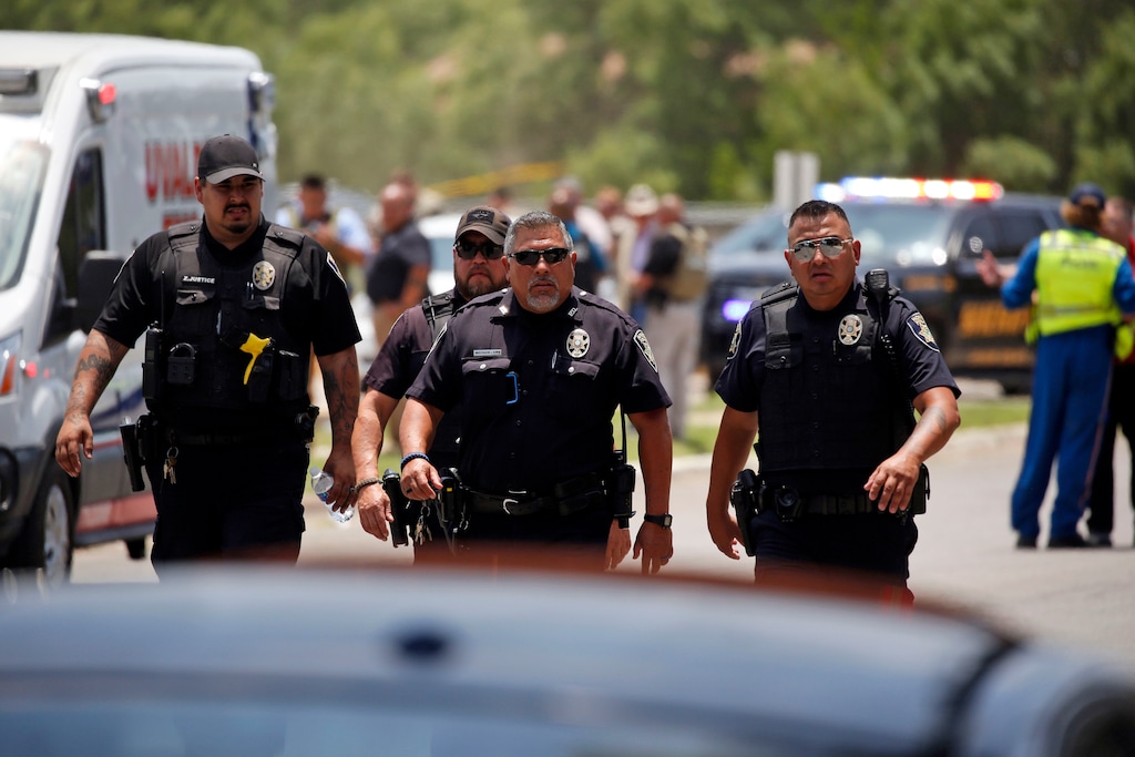 (Dario Lopez-Mills | AP) Police walk near Robb Elementary School following a shooting, Tuesday, May 24, 2022, in Uvalde, Texas.