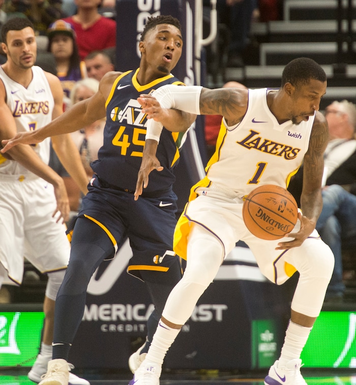 (Rick Egan  |  The Salt Lake Tribune)   Utah Jazz guard Donovan Mitchell (45) defends as Los Angeles Lakers guard Kentavious Caldwell-Pope (1) drives with the ball, in NBA action, Utah Jazz vs. Los Angeles Lakers, in Salt Lake City, Saturday, October 28, 2017.