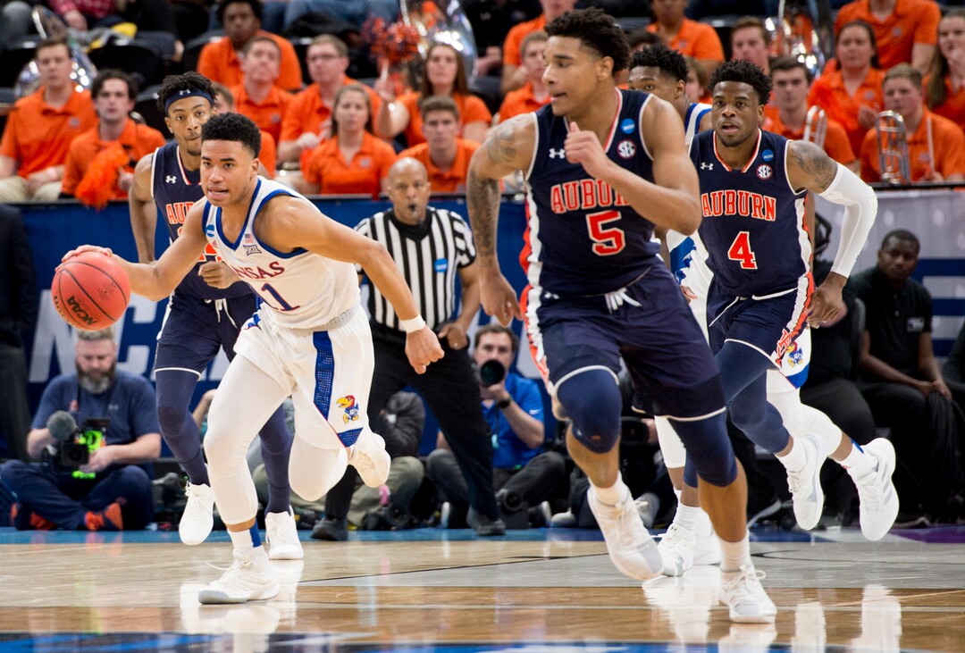 (Leah Hogsten  | The Salt Lake Tribune)  Kansas Jayhawks guard Devon Dotson (11) breaks away from Auburn in the second round of the NCAA tournament in Salt Lake City on Saturday, March 23, 2019.