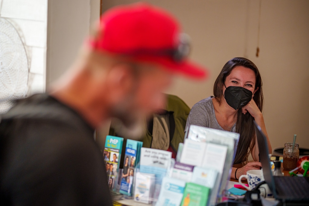 (Trent Nelson  |  The Salt Lake Tribune) Mackenzie Bray talks to a man experiencing homelessness at the Salt Lake Harm Reduction Project's offices on Wednesday, Oct. 2, 2024.