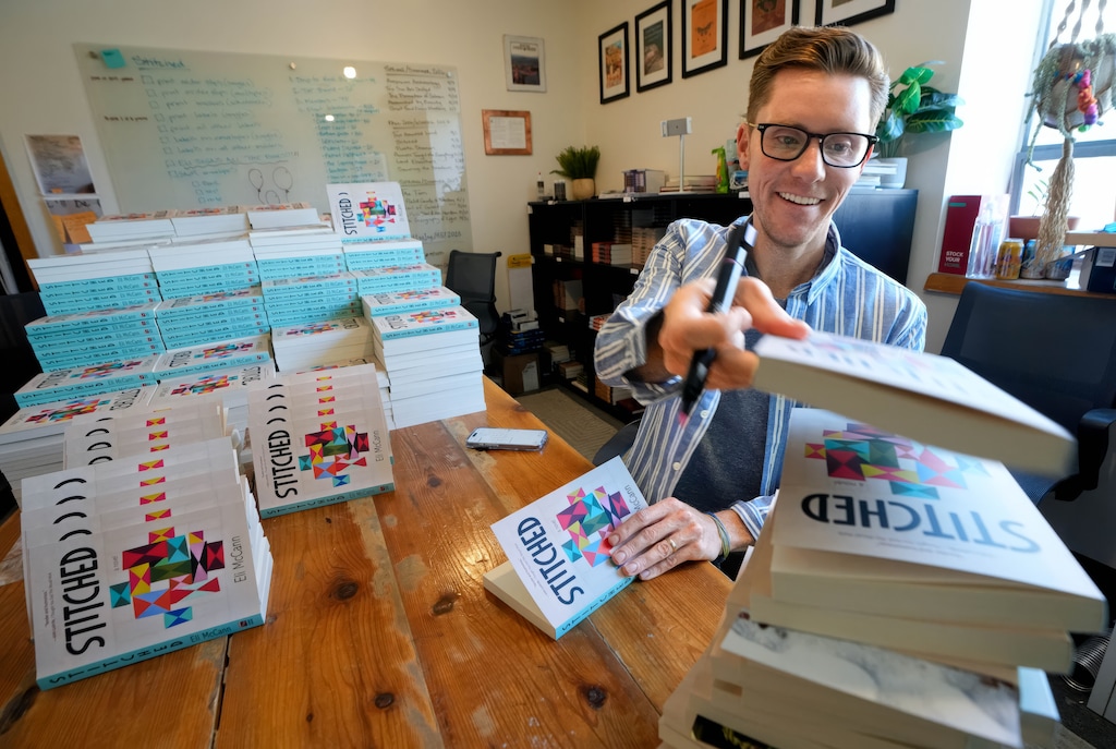 (Francisco Kjolseth | The Salt Lake Tribune) Salt Lake Tribune humor columnist Eli McCann signs copies of his new novel, "Stitched."
