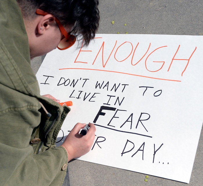 (Al Hartmann  |  The Salt Lake Tribune) 	
Over one hundred students at Highland High School staged a walkout Friday April 20, 2018 in honor of the anniversary of the Columbine High School massacre. Demonstrators walked from the school to Sugar House Park where they made posters, wrote letters to their congressmen and listened to speakers. 