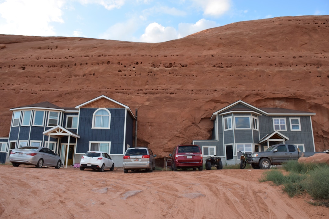 (Shannon Mullane for High Country News) The Fosters and other families blasted holes in sandstone before filling them with suburban-style homes at Rockland Ranch.