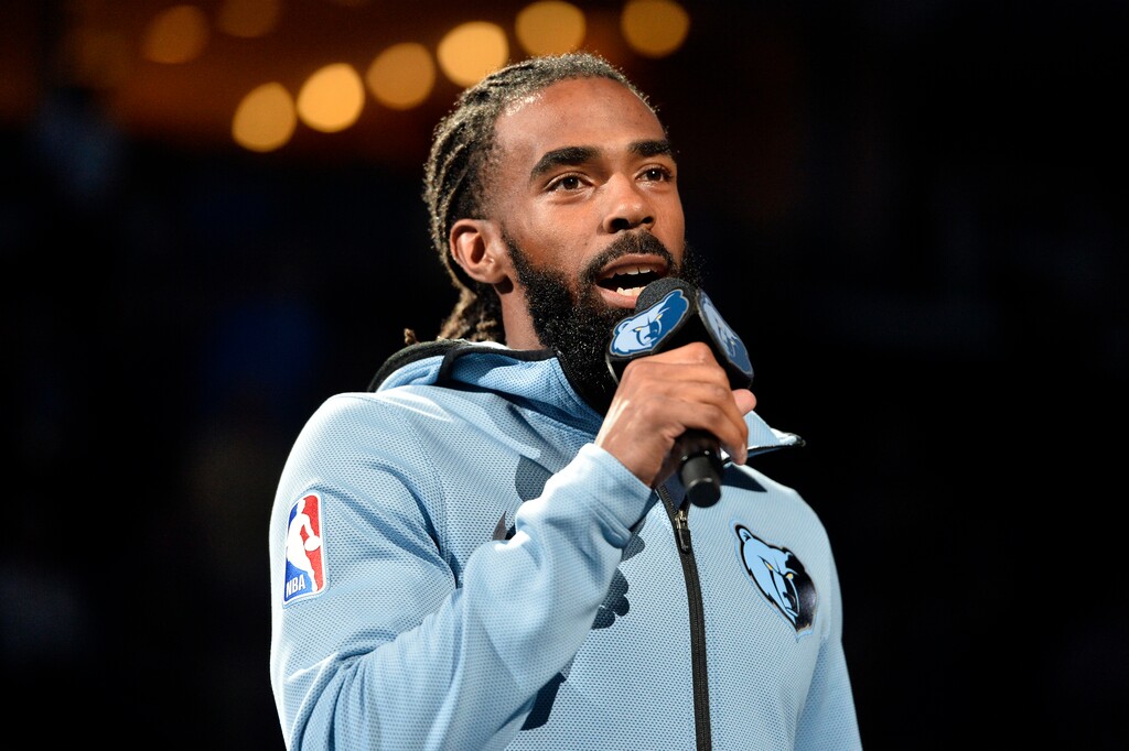 Memphis Grizzlies guard Mike Conley addresses fans before an NBA basketball game against the Golden State Warriors Wednesday, April 10, 2019, in Memphis, Tenn. (AP Photo/Brandon Dill)