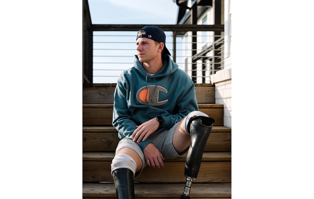 (Rana Young | The New York Times) Hunter Woodhall at his home in Fayetteville, Ark., on March 21, 2021. Woodhall made history in track and field, but NCAA restrictions on athletes’ earnings drove him out of college sports.