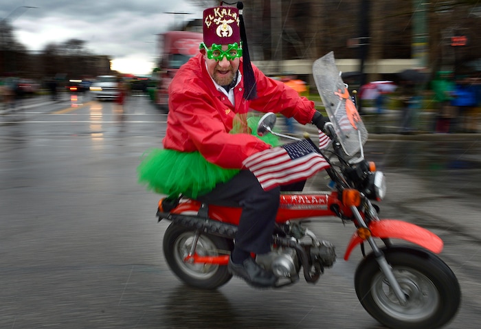 (Scott Sommerdorf | The Salt Lake Tribune) A Shriner speeds by during the 40th annual Salt Lake City St. Patrick's Day Parade on Saturday, March 17, 2018.
