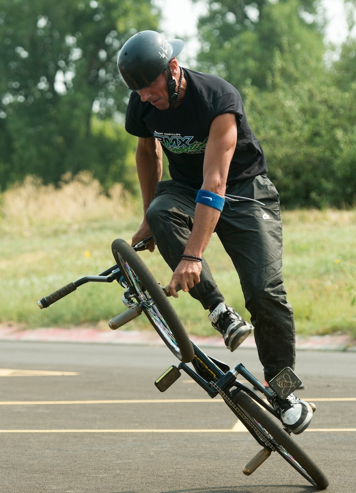 (Rick Egan  |  The Salt Lake Tribune)    Pete Brandt performs a bike trick, during the BMX Stunt Show, at the Davis County Fair in Farmington, Saturday, Aug. 18, 2018.