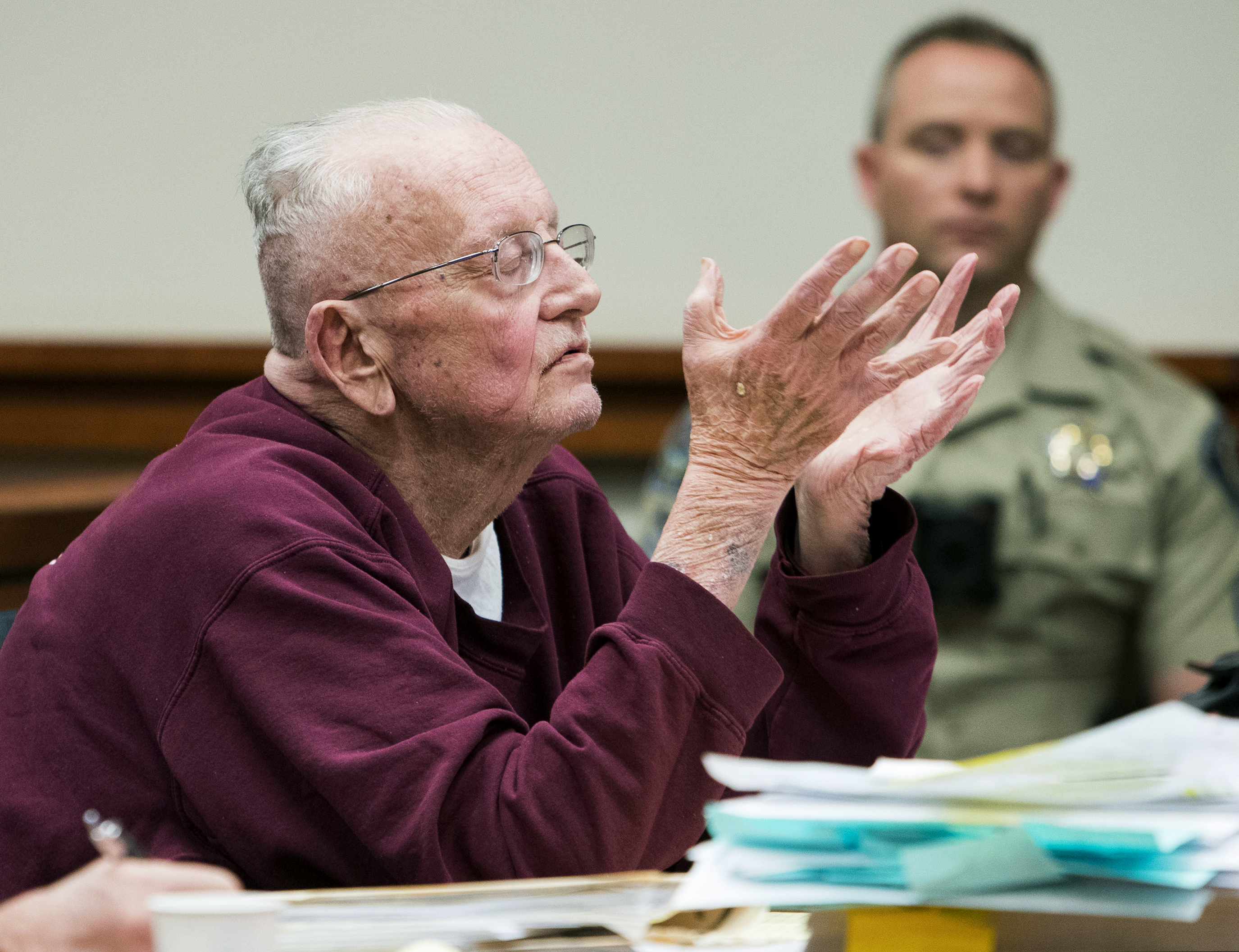 (Darin Oswald | Idaho Statesman via AP) Father William Thomas Faucher speaks during his sentencing Thursday, Dec. 20, 2018, at the Ada County Courthouse in Boise, Idaho. Faucher was sentenced to 25 years in prison without parole after pleading guilty to five felony crimes that included possession and distribution of child pornography.