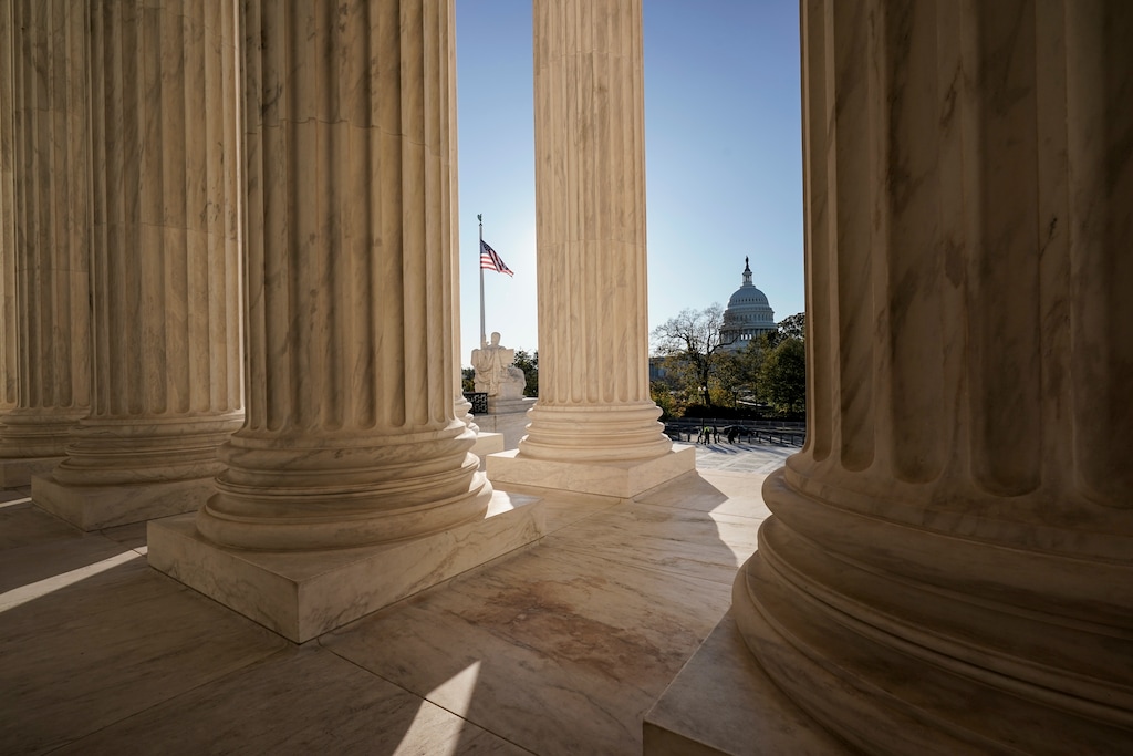 FILE - This Nov. 4, 2020, file photo shows the Supreme Court in Washington, with the Capitol in the distance. (AP Photo/J. Scott Applewhite, File)