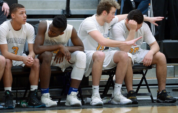 (Leah Hogsten  |  The Salt Lake Tribune) Summit's Britton Williams talks with Nicholas Maness who fouled out of the game. Juab High School boys' basketball team defeated Summit Academy 61-58 in overtime during their 3A State tournament game in Heber  Saturday, Feb. 16, 2018.