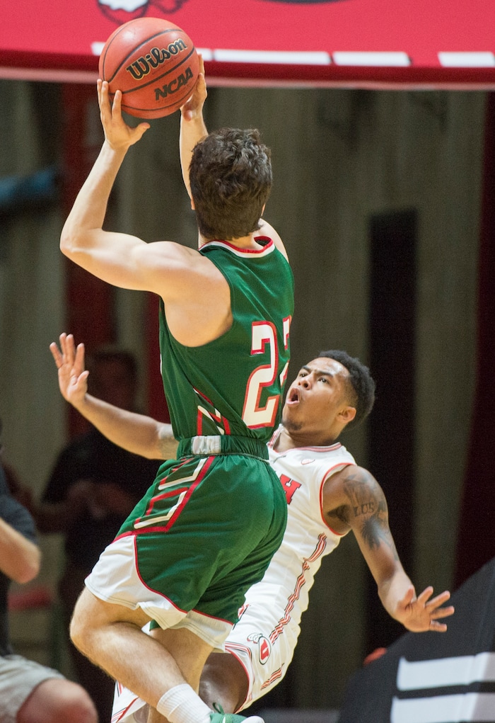(Rick Egan  |  The Salt Lake Tribune)  Mississippi Valley State Delta Devils guard Nate Nahimy (22) collides with Utah guard Justin Bibbins (1), in basketball action Utah Utes vs. Mississippi Valley State Delta Devils, at the Jon M. Huntsman Center,  Monday, November 13, 2017.