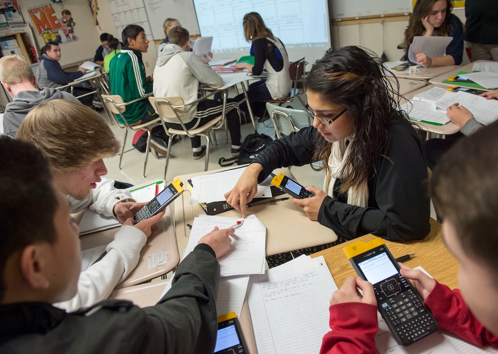 Keith Johnson | The Salt Lake TribuneStudents in Rob Lake's introduction to statics class use their Texas Instruments wireless calculators  at Kearns High School, February 5, 2014 in Kearns, Utah. Each student has a calculator that transmits its data onto a screen for all to see. The Utah Legislature is looking into infusing millions of dollars for technology in Utah classrooms. Kearns High received a one million dollar grant 3 years ago, allowing every student to get an iPod touch to help in the classroom. The results were mixed. 