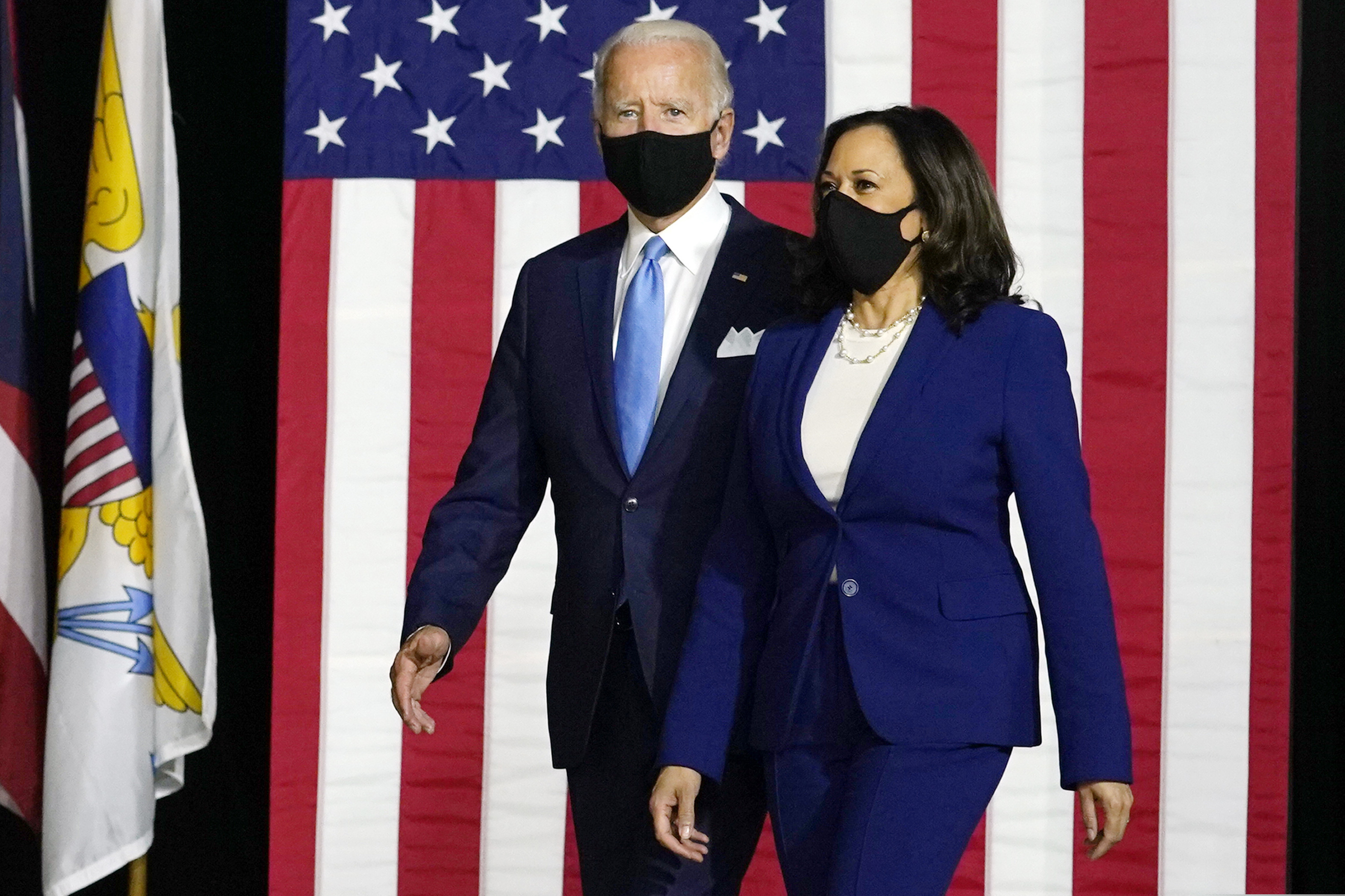 FILE - In this Aug. 12, 2020, file photo Democratic presidential candidate former Vice President Joe Biden and his running mate Sen. Kamala Harris, D-Calif., arrive to speak at a news conference at Alexis Dupont High School in Wilmington, Del. (AP Photo/Carolyn Kaster, File)
