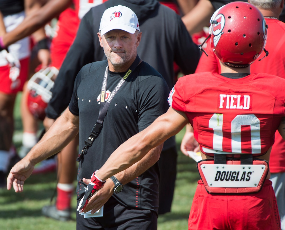 (Rick Egan  |  The Salt Lake Tribune)     Coach Kyle Whittingham greets his players during practice.  Whittingham is entering his 14th year as Utah head coach, Wednesday, Aug. 15, 2018.