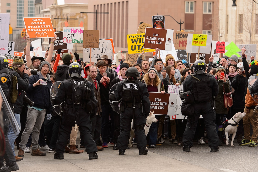 (Trent Nelson | The Salt Lake Tribune)  Police and protesters downtown after a rally against a visit by President Donald Trump, Monday December 4, 2017.