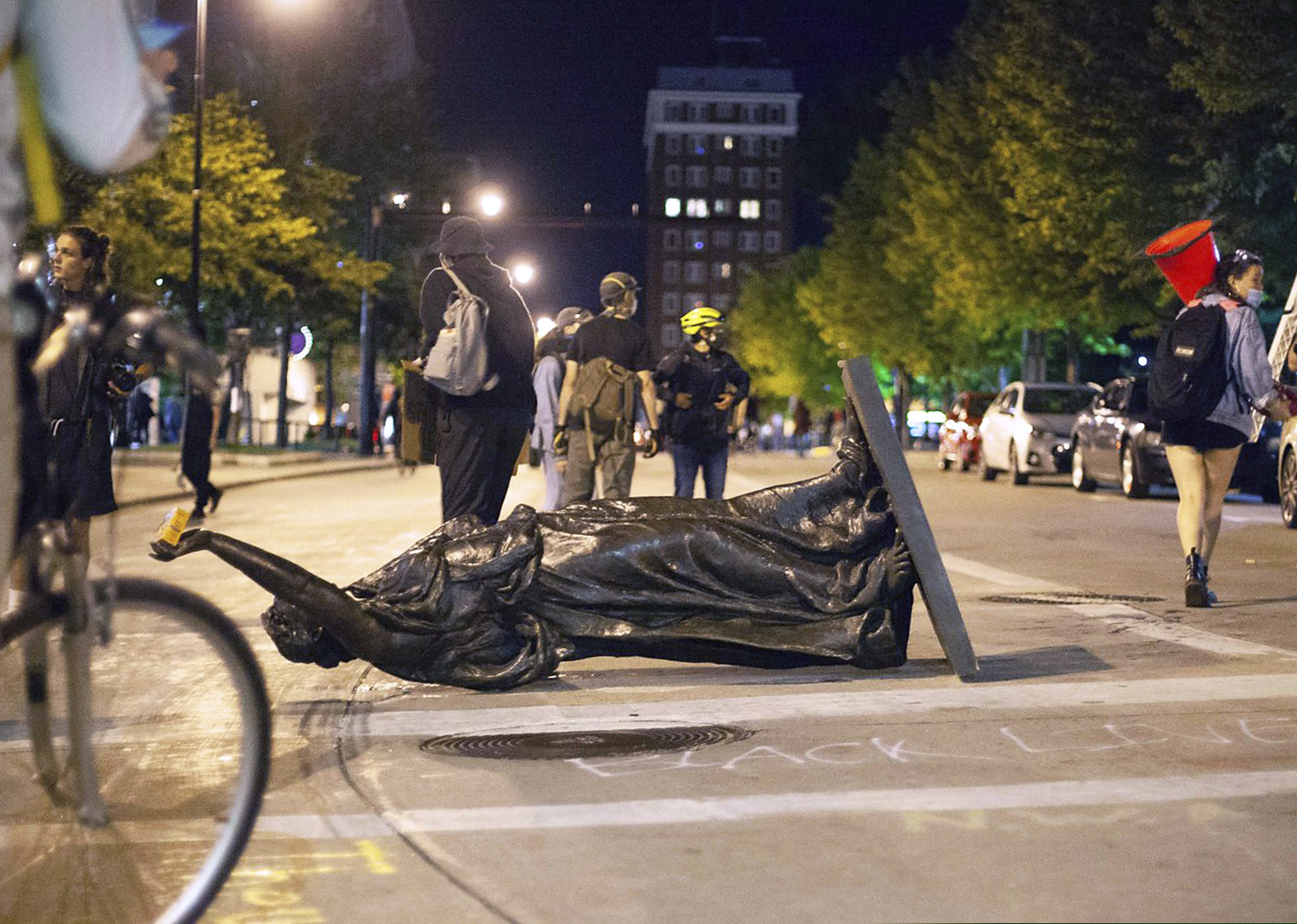 (Emily Hamer | Wisconsin State Journal via AP file photo)  Wisconsin's "Forward" statue lies in the street on Capitol Square in Madison, Wis., on June 23, 2020.