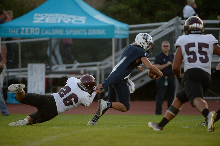 (Francisco Kjolseth  |  The Salt Lake Tribune)  Jordan's Aysaiah Fawson grabs on to the shirt of Ty Melcalfe of Syracuse in game action at Syracuse on Thursday, Aug. 24, 2017.