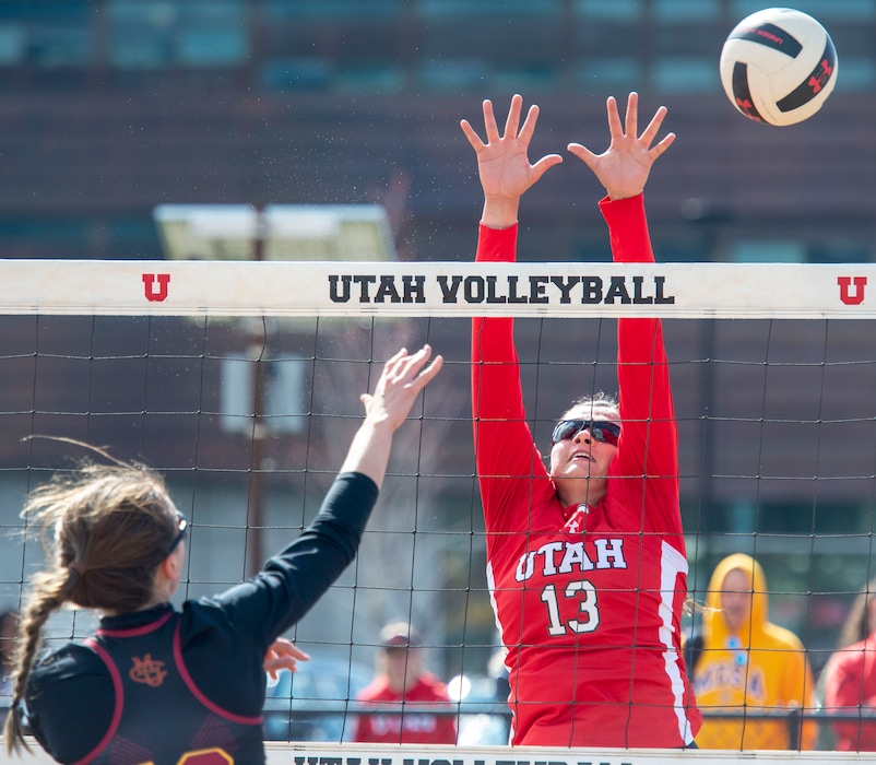 (Rick Egan  |  The Salt Lake Tribune)     Magdalena Dabrowski hits the ball for CMU, as Kinga Windish defends, for Utah, in beach volleyball action between Utah and Colorado Mesa, in the first home tournament in history for the University of Utah, Saturday, April 13, 2019.