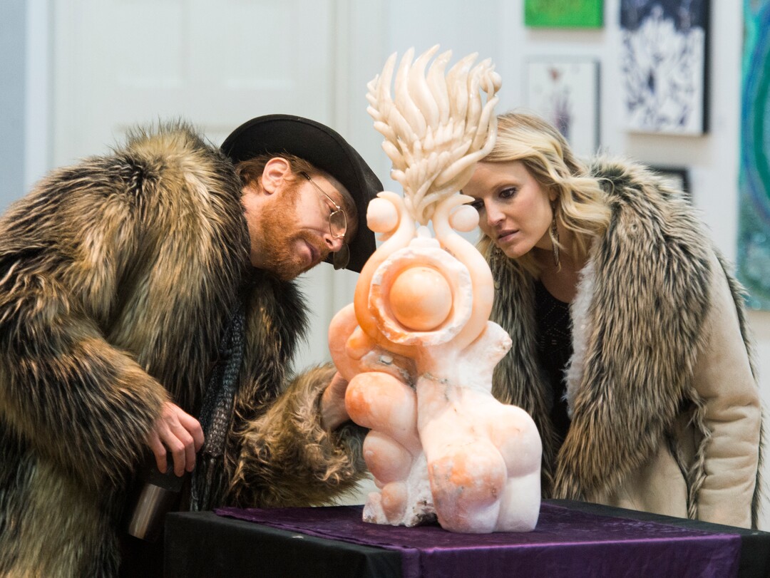 (Rick Egan  |  The Salt Lake Tribune)      Artist Mykael Lazzeri (left) talks about one of his art pieces with his wife Jamie, during the gallery stroll, at the Urban Arts Gallery, on Rio Grande Street, Friday, Nov. 16, 2018.