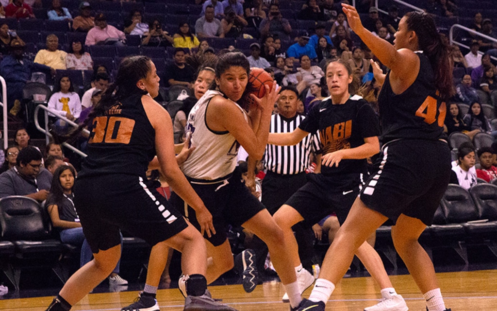 (Nate Fain | Cronkite News) The NABI Foundation is about basketball but also furthering education. The Navajo Nation Elite smothered Yakama Nation in the Girls Division I Final in the foundation's tournament at Talking Stick Resort Arena.