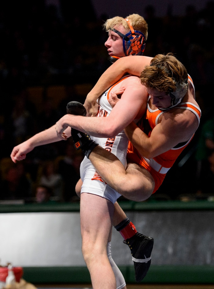 (Steve Griffin  |  The Salt Lake Tribune) Zac Musselman, of Monticello, clings to the back of Brighton's Brayden Stevens during the All-Star Duals wrestling at Utah Valley University's UCCU Center in Orem Tuesday January 9, 2018.