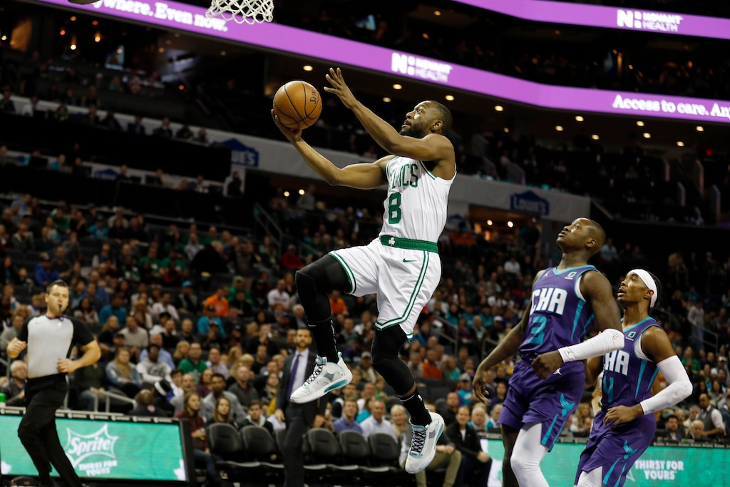 (AP Photo/Bob Leverone) | Boston Celtics' Kemba Walker (8) slips by for an easy two as Charlotte Hornets' Terry Rozier (3) and Devonte' Graham (4) trail in the paint during the first half of an NBA basketball game in Charlotte, N.C., Tuesday, Dec. 31, 2019. The two teams are just part of a large cast of also-rans weighing down a supposedly improved Eastern Conference this season.