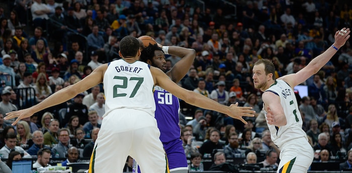 (Francisco Kjolseth  |  The Salt Lake Tribune)  Sacramento Kings forward Caleb Swanigan (50) faces the wingspan of Utah Jazz center Rudy Gobert (27) and Utah Jazz forward Joe Ingles (2) as the Utah Jazz host the Sacramento Kings in their NBA game at Vivint Smart Home Arena Friday, April 5, 2019, in Salt Lake City.