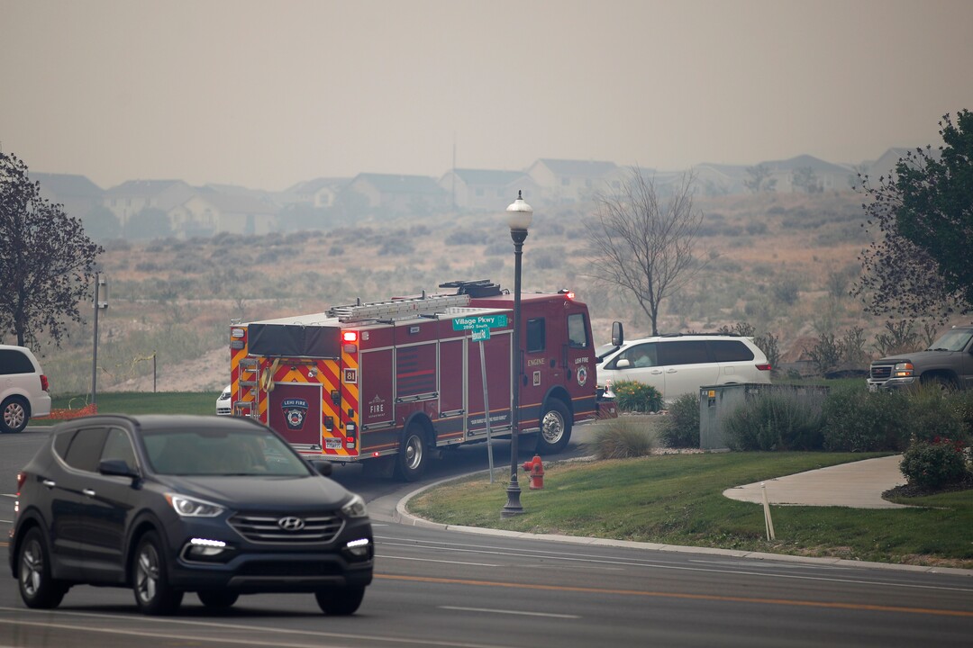 (George Frey  |  for The Salt Lake Tribune) A  fire truck makes it way to homes in south Saratoga Springs due to a wildfire on June 28, 2020.