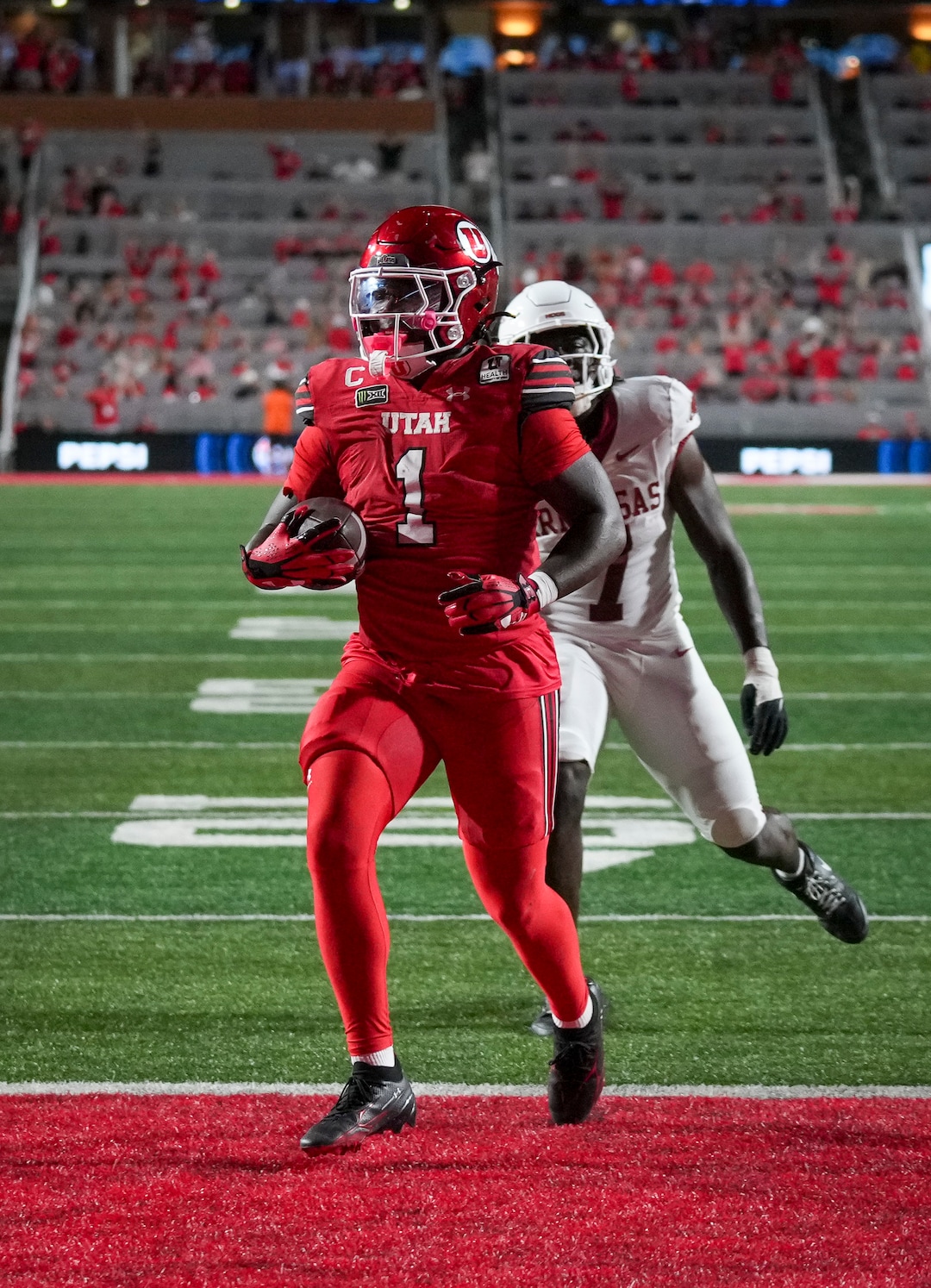 (Bethany Baker  |  The Salt Lake Tribune) Utah Utes running back Wayshawn Parker (1) runs the ball in for a touchdown during the game between the Utah Utes and the Arkansas Razorbacks in Salt Lake City on Saturday, Sept. 12, 2026.