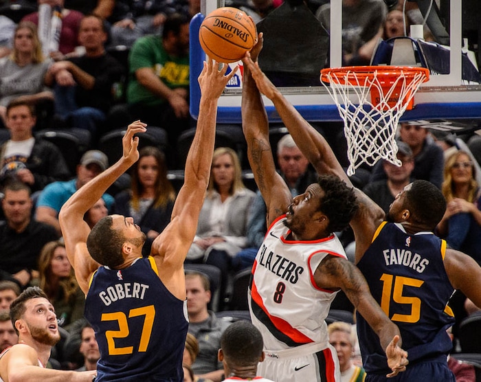 (Trent Nelson | The Salt Lake Tribune)  Utah Jazz center Rudy Gobert (27) puts up a shot, blocked by Portland Trail Blazers forward Al-Farouq Aminu (8) as the Utah Jazz host the Portland Trail Blazers, NBA basketball in Salt Lake City, Wednesday November 1, 2017.