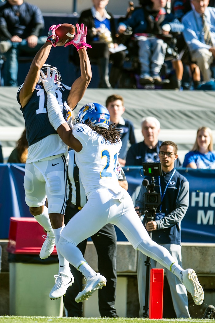 (Chris Detrick  |  The Salt Lake Tribune)  Brigham Young Cougars wide receiver Micah Simon (13) makes a touchdown catch past San Jose State Spartans cornerback Andre Chachere (21) during the game at LaVell Edwards Stadium Saturday, October 28, 2017.  