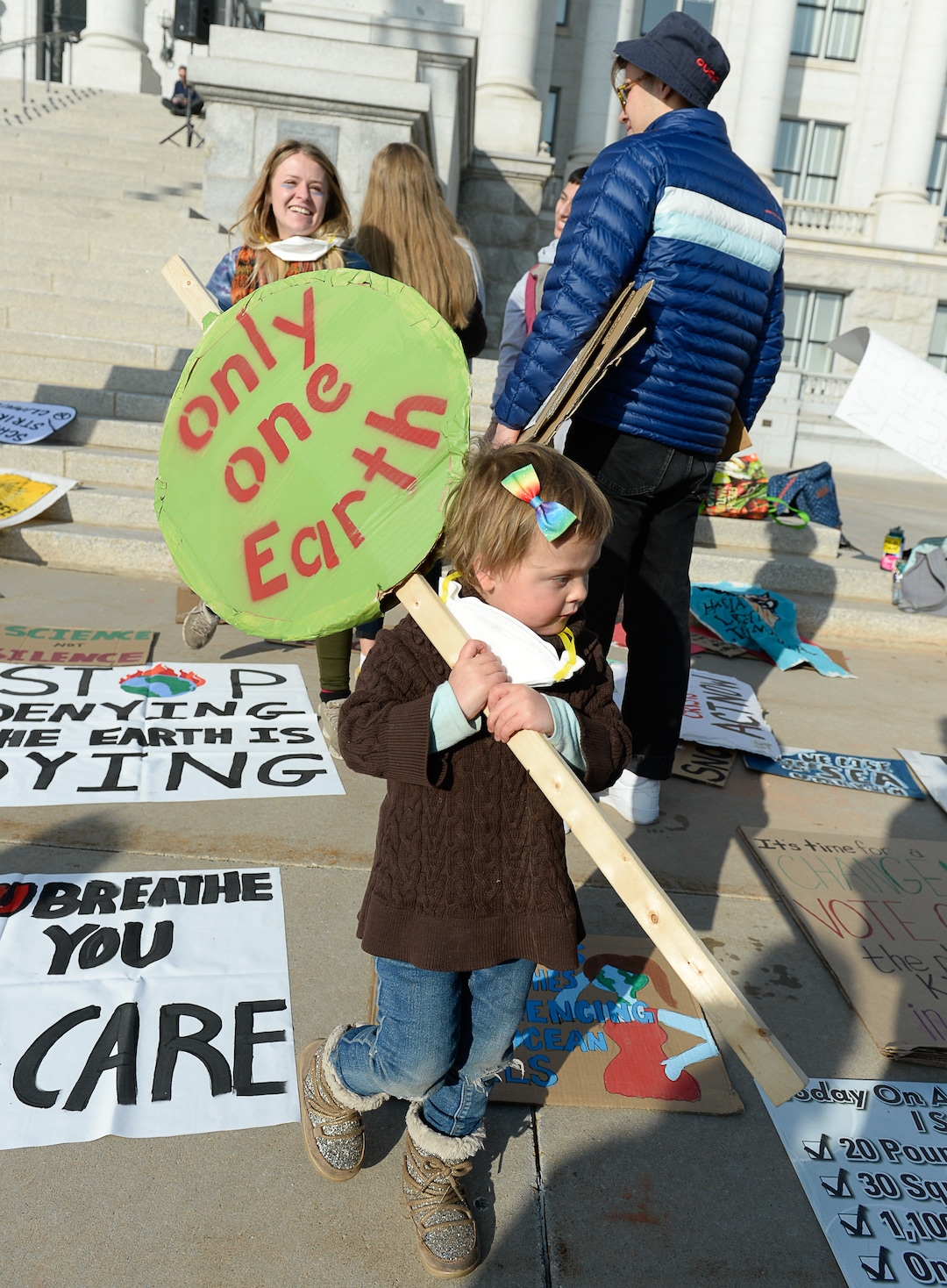 (Francisco Kjolseth  |  The Salt Lake Tribune)  Lilly Moore, 3, joins other environmental activists at the Utah Capitol for a rally on climate action on Friday, Dec. 6, 2019.