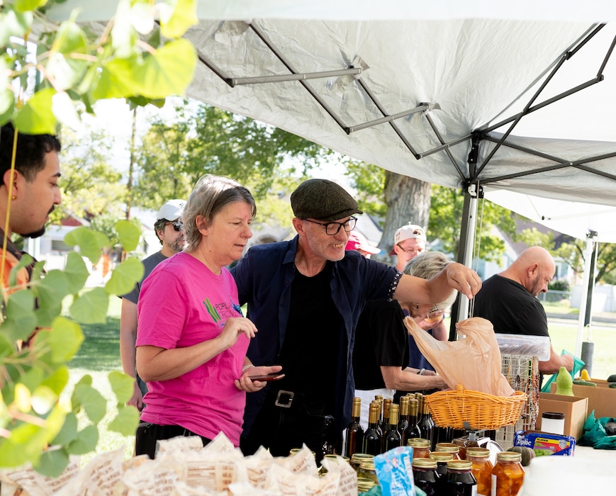 (Rachel Rydalch | Special to The Tribune) Christy Sapp and Paul Hopper, frequent 9th West Farmers Market shoppers, purchase produce at the market on Sunday, Sept. 13, 2026.