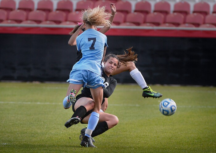 (Scott Sommerdorf | The Salt Lake Tribune)
Sky View goalkeeper Kelsea Cracroft collides with team mate Samantha Tippets and a Bonneville player while making a save during first half play. Sky View defeated Bonneville 2-0 to win the 4A title game, Saturday, October 21, 2017.
