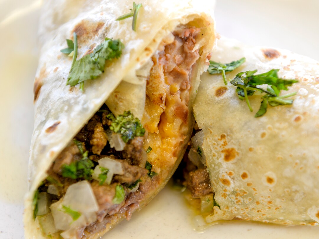 (Leah Hogsten  |  The Salt Lake Tribune)  Steak burrito with beans, rice, cheese, cilantro and onions at Taqueria Los Lee.