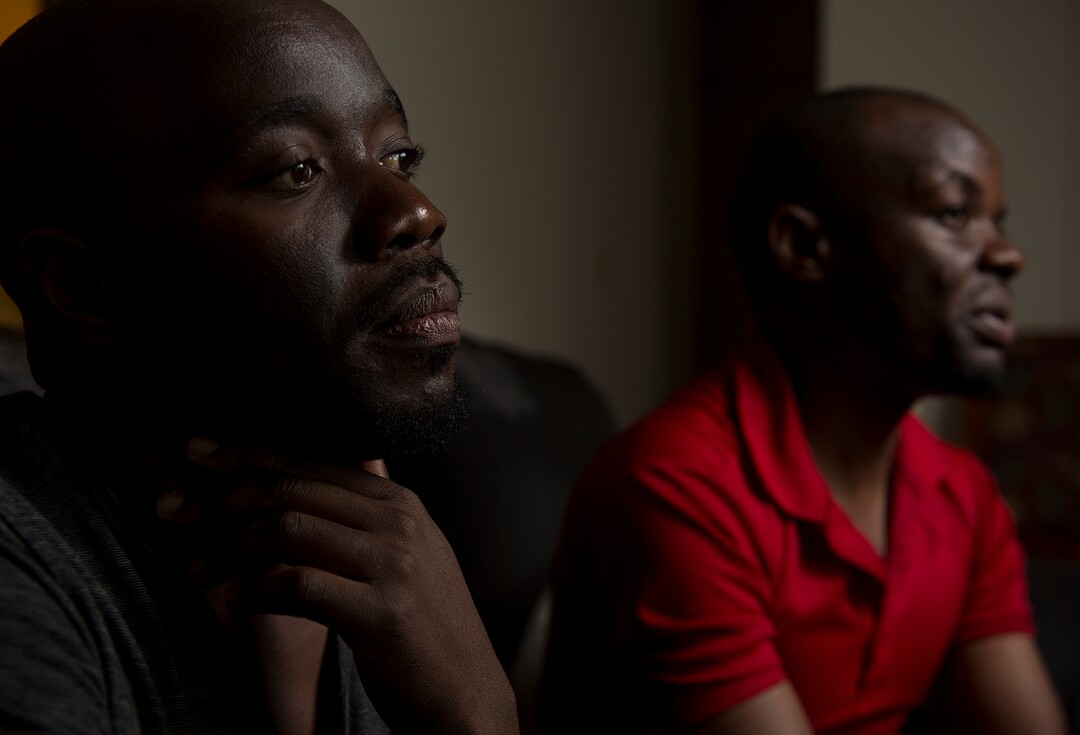 (Leah Hogsten  |  The Salt Lake Tribune) l-r In their native Uganda, a place where being gay can send you to prison, Barnabas Wobiliya and Apollo Kimuli risked their lives as advocates for AIDS education and equality for the LGBTQ community. Threatened with death, both men fled and spent a year in refugee camps before resettlement in Utah. The two are now trying to build their lives here, while using the Internet to continue their activism for others in Africa's LGBTQ community.
