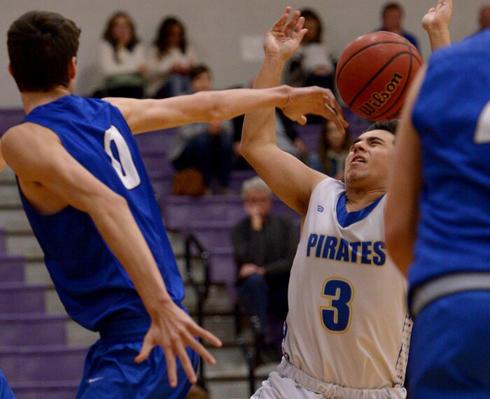 (Leah Hogsten  |  The Salt Lake Tribune) Dixie's Derek Cox knocks the ball from Cyprus' Cody Meza. Dixie High School defeated Cyprus High School boys' basketball team 59-52 during the Riverton Holiday Tournament in Riverton, December 28, 2017. 